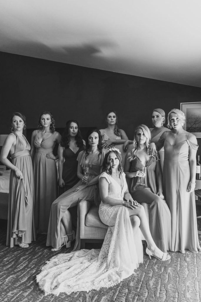 A timeless black and white photograph captures a magazine-worthy moment of the bridal party, highlighting the beauty of the bride and her bridesmaids. L Hewitt Photography

