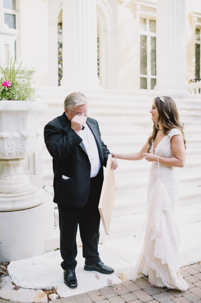 The bride's father wipes away tears of joy as he witnesses his daughter on her special day. L Hewitt Photography

