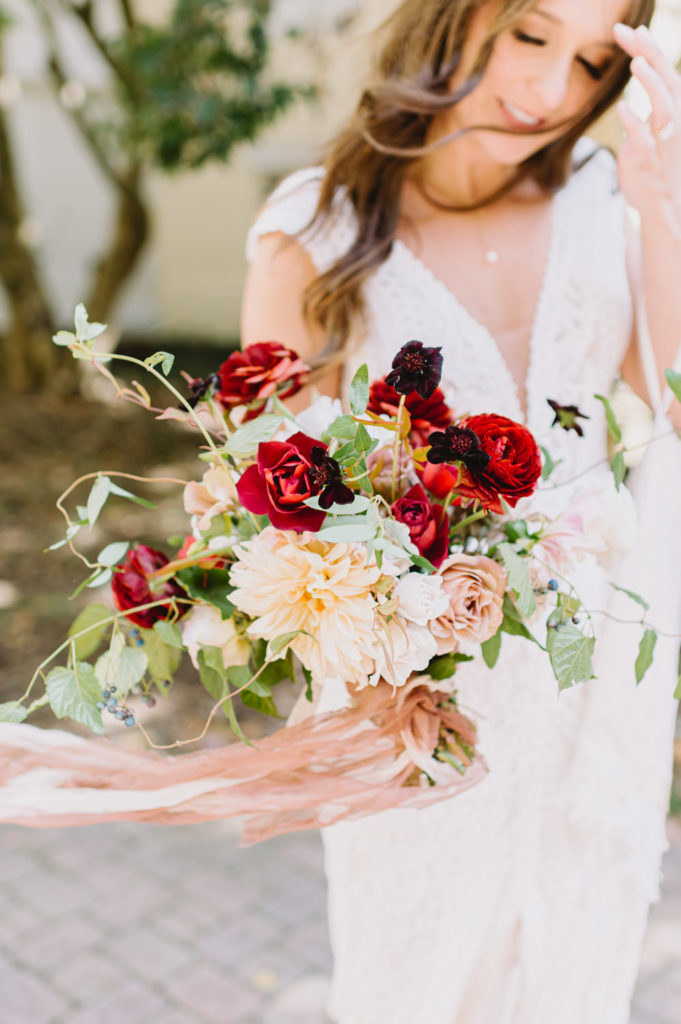 A stunning bride poses with her romantic wedding bouquet L Hewitt Photography


