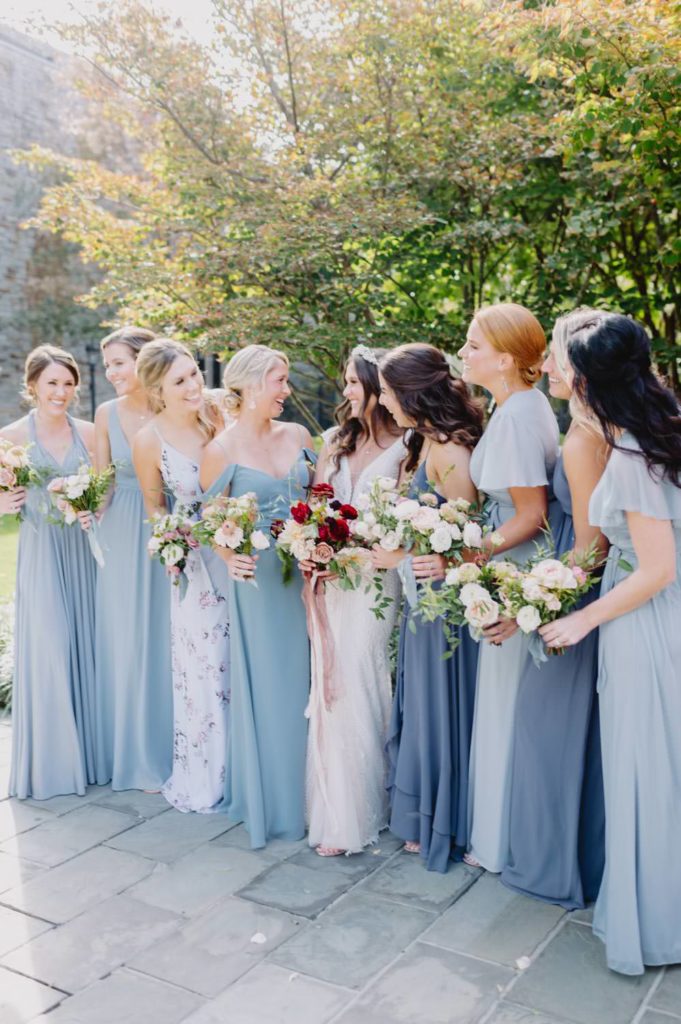The bridal party exudes joy during the wedding ceremony L Hewitt Photography


