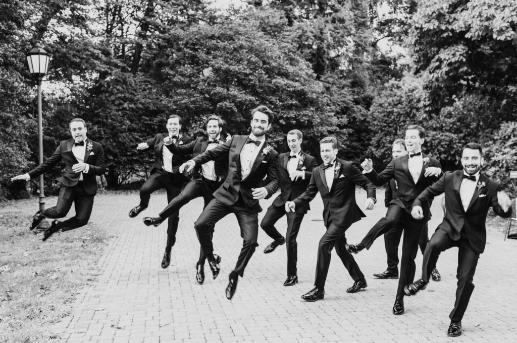 The groom and his groomsmen strike a wacky jumpshot L Hewitt Photography

