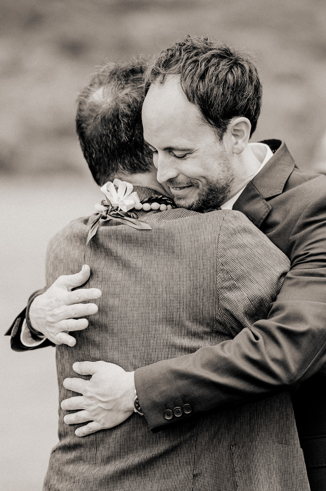 Emotional embrace between the groom and the bride's father L Hewitt Photography