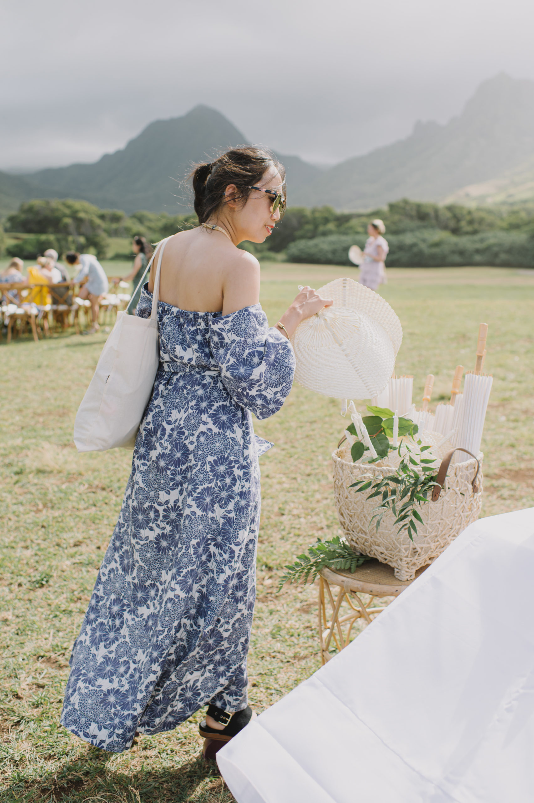 Candid shot of guests preparing for the ceremony at Kualoa Ranch L Hewitt Photography