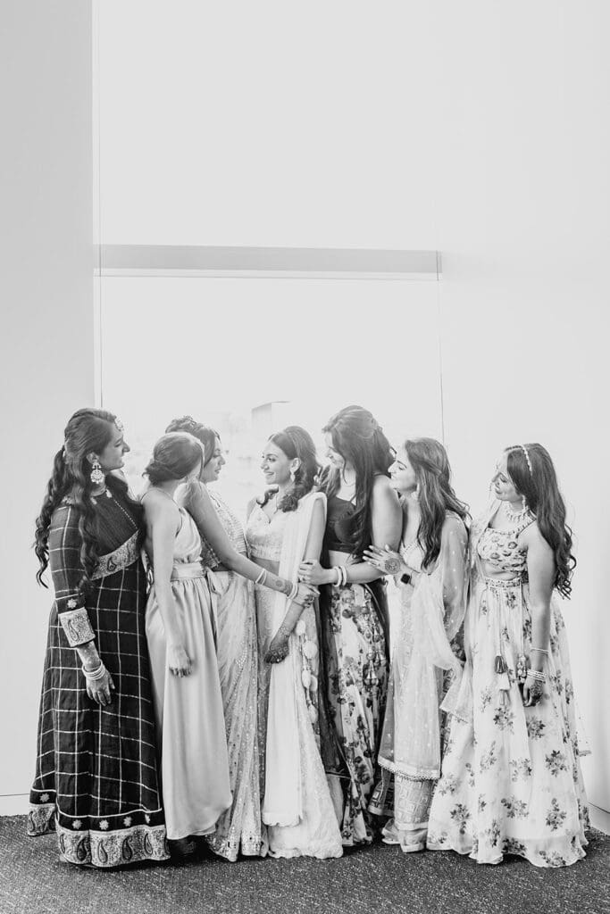 bride wearing a lilac lehenga with her bridesmaids before the Indian wedding reception at Capital One Hall. L Hewitt Photography