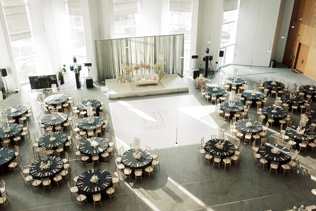 luxurious Indian wedding reception with color themes including gold designed by S W Events at Capital One Hall. L Hewitt Photography