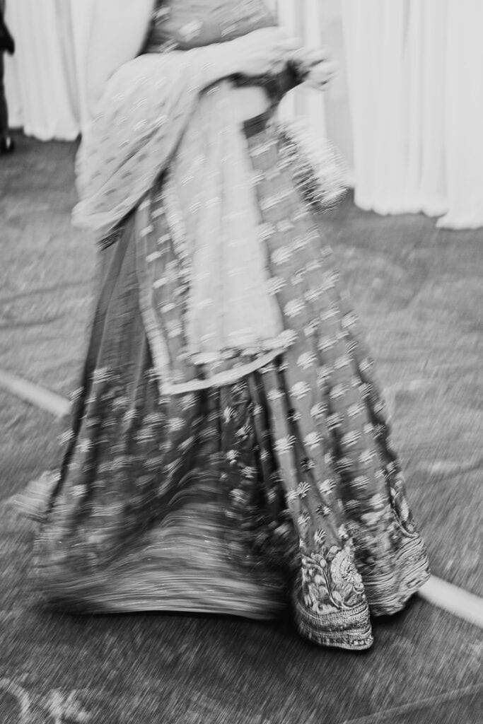 beautiful lehenga with patterns for the Indian wedding reception at Capital One Hall. L Hewitt Photography